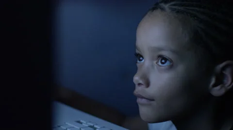 4K Close up of young child on a computer screen at night, in slow motion 스톡 동영상 56717515