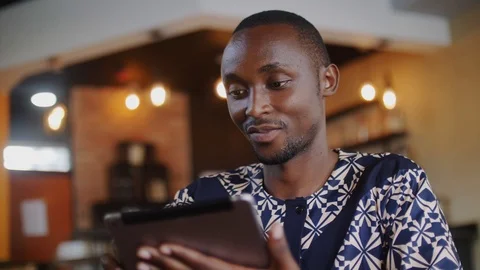 4k close up, young handsome man enjoying wireless internet in the modern coffee Vídeo Stock 111333155