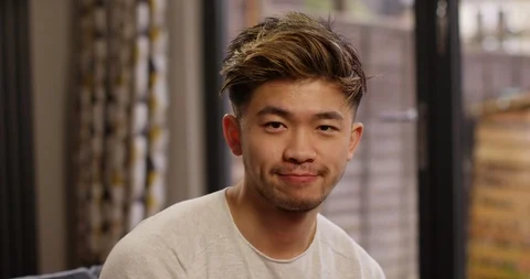 4K Close up young man on boring video call, nodding &amp; trying to look interested Stock Footage 86719623