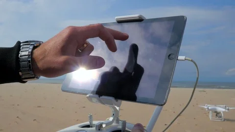 4k close up of young man preparing drone for fly on tab Video stock 83924543