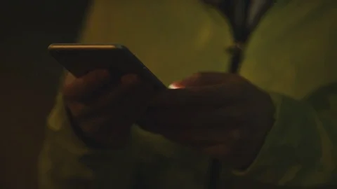 4K Close up of young woman using her phone in the city at night Stock Footage 72669248