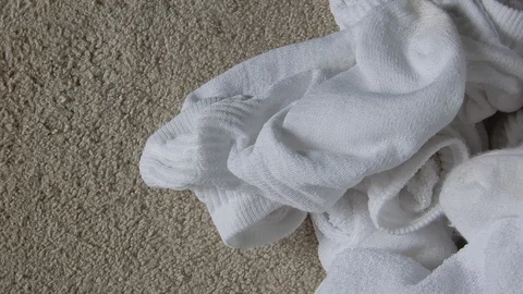 4K Closeup Dirty White Socks Pile Pan Left To Right Stock Footage 89562020