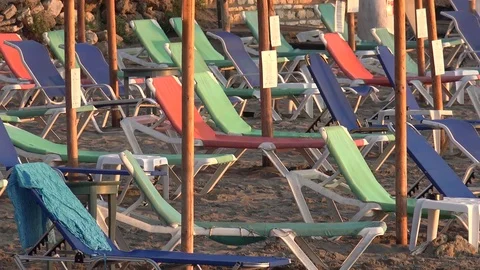 4K Closeup empty sunbed on sandy beach colorful lounge chair in summer holiday Stock Footage 80056588