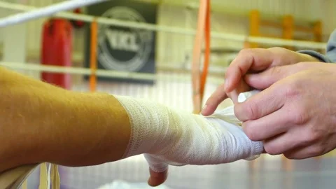 4k Closeup of fighter hand rubbing in protective wrap. Video stock 77443940