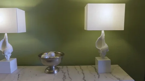 4K Closeup Pan of Seashell Lamps on Marble Table Stock Footage 109380499