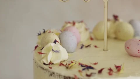 4K closeup shot of a delicious Easter Frohe Ostern Naked Cake on a white Stock Footage 150789719