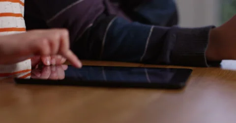 4k, closeup shot of kids playing online games on a digital touchscreen tablet. Stock Footage 61380351