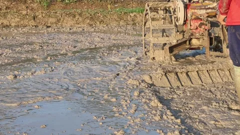 4k of closeup Thai farmer driving tiller tractor 스톡 동영상 336037178