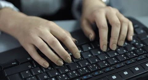 4K: A Closeup view from fast typing female hands on a black keyboard. Stock Footage 67727234