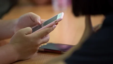 4K, Closeup young students reading a text on smart phone. Education concept.-Dan Stock Footage 114479280