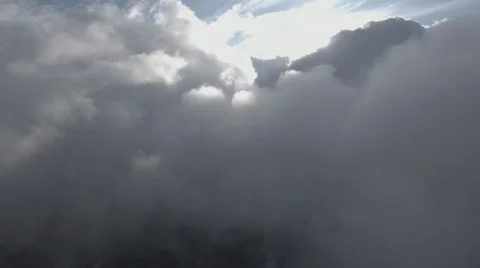 4K Cloud Aerial: Panning Across Sun &amp; Moving Clouds/Background Plate Stock Footage 65325075