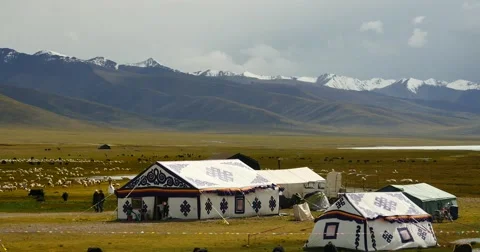 4k clouds mass rolling over Tibet lake namtso,herdsman tent,a group of cow. Stock Footage 45534530