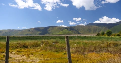 4k clouds mass rolling over mountains in Shangri-La yunnan,Napahai grassland. Stock Footage 46266630