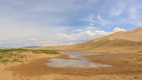 4K. Clouds over the Gobi desert, dune Hongoryn, Mongolia. Ultra HD, 4096x2304 Stock Footage 73916069