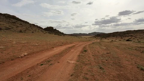 4K. Clouds over the mountains Baga Gazriin Chuluu, Mongolia. Ultra HD, 4096.. Video stock 73917410