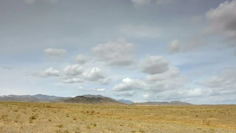 4K. Clouds over the Sands Mongol Els, Mongolia. Ultra HD, 4096x2304 Stock Footage 73759659