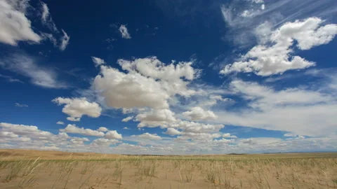 4K. Clouds over the Sands Mongol Els, Mongolia. Ultra HD, 4096x2304 Stock Footage 106969397