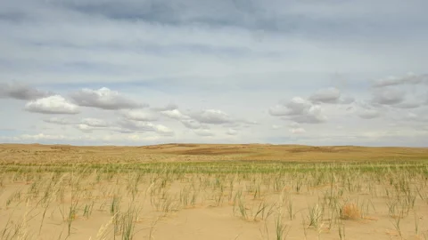 4K. Clouds over the Sands Mongol Els, Mongolia. Ultra HD, 4096x2304 Stock Footage 106970677