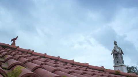 4K Cloudy Dawn traditional tile rooftop 45º Pan Timelapse Stock Footage 56242842
