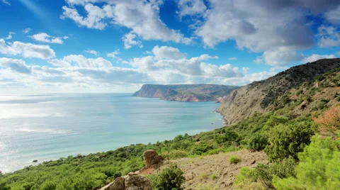 4K. Cloudy sky over the mountains and the sea. Balaklava, Crimea, Russia.  Stock Footage 44403577