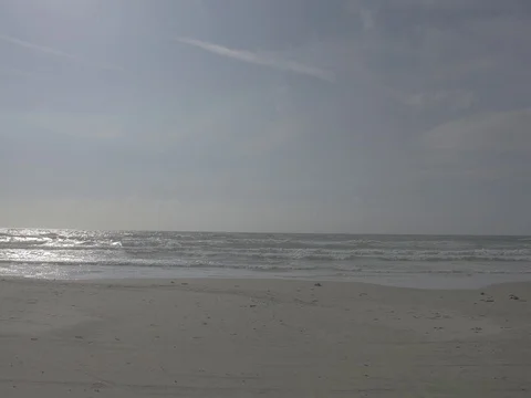4k coast with beach and ocean on a sunny day Stock Footage 75215979