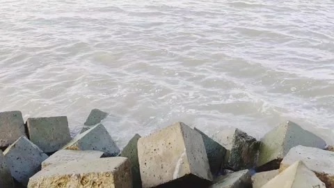 4K Coastal Waves Moving Against Concrete Sea Wall Breakwater Stock Footage 337832109