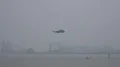 4k Coastguard helicopter flying at rainy day in Bremerhaven harbor 4k or 4k+ Resolution