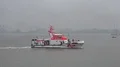 4k Coastguard rescue lifeboat in Bremerhaven harbor river at rainy day 4k or 4k+ Resolution