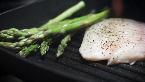 4k Cod Fish Cooking Process with Vegetables on Grill Stock Footage 80973592