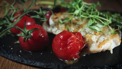 4k Cod Fish Fillet Cooked and Served with Vegetables Stock Footage 80976143