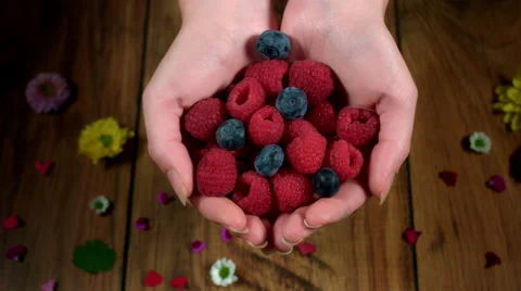4k Colourful Composition of Fresh Berries in Hand - Wooden Background Vídeo Stock 66587631