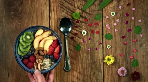 4k Colourful Composition of Fresh Healthy Breakfast in Hand - Wooden Background Stock-Footage 66590776