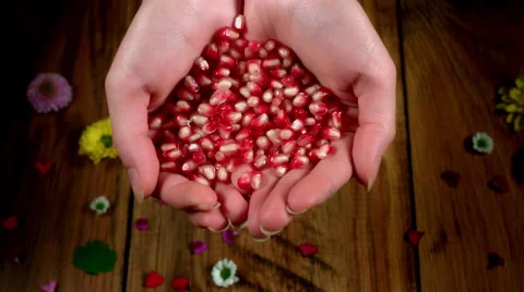 4k Colourful Composition of Fresh Pomegranate in Hand - Wooden Background Vídeo Stock 66587948