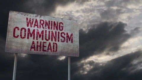 4K Communism Ahead Warning Rusty Sign under Clouds Timelapse Stock Footage