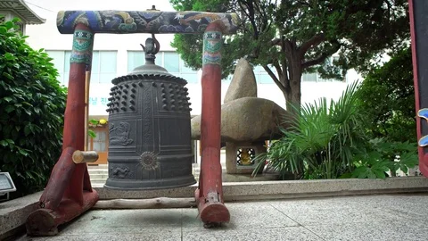 4K Compact bell outside the main hall door at Daegaksa Buddhist temple Busan-Dan Stock Footage