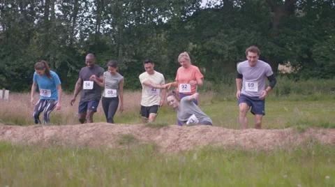 4K Competitive team in assault course race getting ready at the starting line Stock Footage 65829267