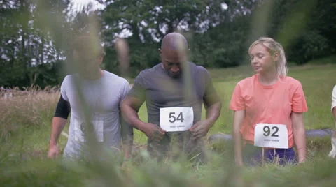 4K Competitive team in assault course race getting ready at the starting line Stock Footage 65875714