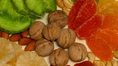 4k – Composition of different dried fruit and nuts on plate 01 Stock Footage 56149588