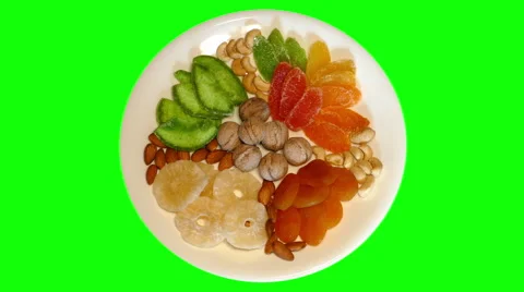 4k – Composition of different dried fruit and nuts on plate Stock Footage 56456298