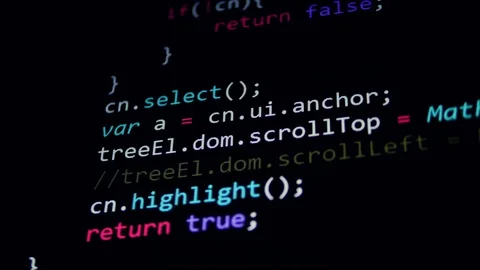 4K. Computer code on display screens in a dark Video stock 75569069