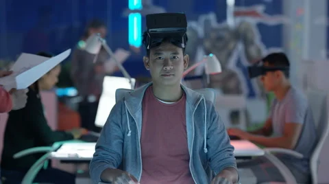 4K Computer game designer looks directly... | Stock Video | Pond5