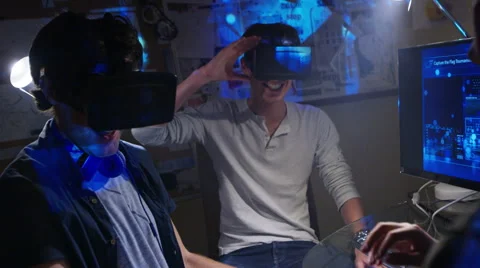 4K computer gamers remove virtual reality viewers after coming out of a game Stock Footage 54389945