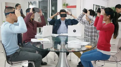 4K Computer programmers trying out virtual reality viewers Stock Footage 61719376