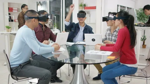 4K Computer programmers trying out virtual reality viewers Video stock 61771928
