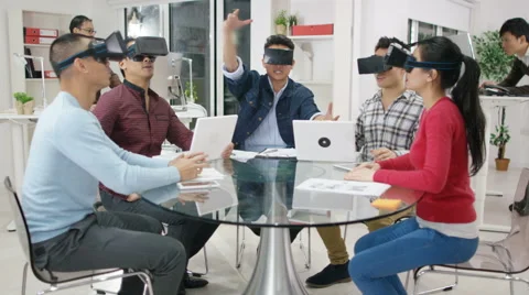 4K Computer programmers trying out virtual reality viewers Video stock 61772522