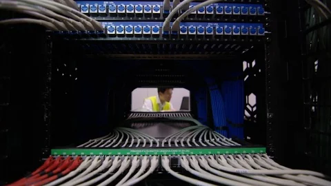 4K Computer technician checking the equipment in a data center server room Stock Footage 75051205