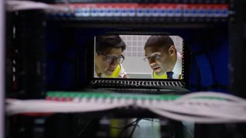 4K Computer technicians checking the servers in a data center Stock Footage 75045047