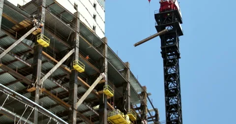 4k Construction Crane lowering I-Beam Stock Footage 51058861