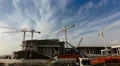4K construction site workers timelapse cranes and machinery HD Footage