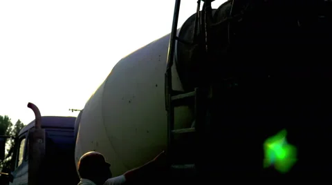 4K, Construction worker climbing on a cement truck Stock Footage 53226411